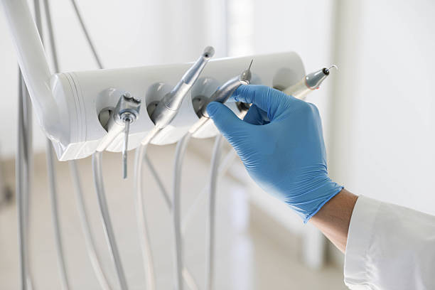 Professional Tooth Extraction technician working in DeWitt, MI
